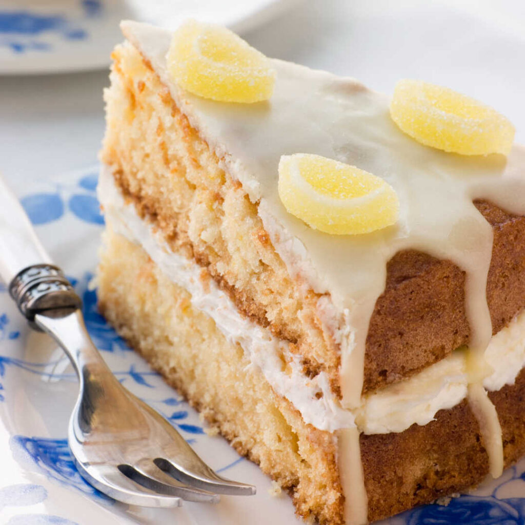 Slice of Lemon Drizzle Cake on Plate with Fork